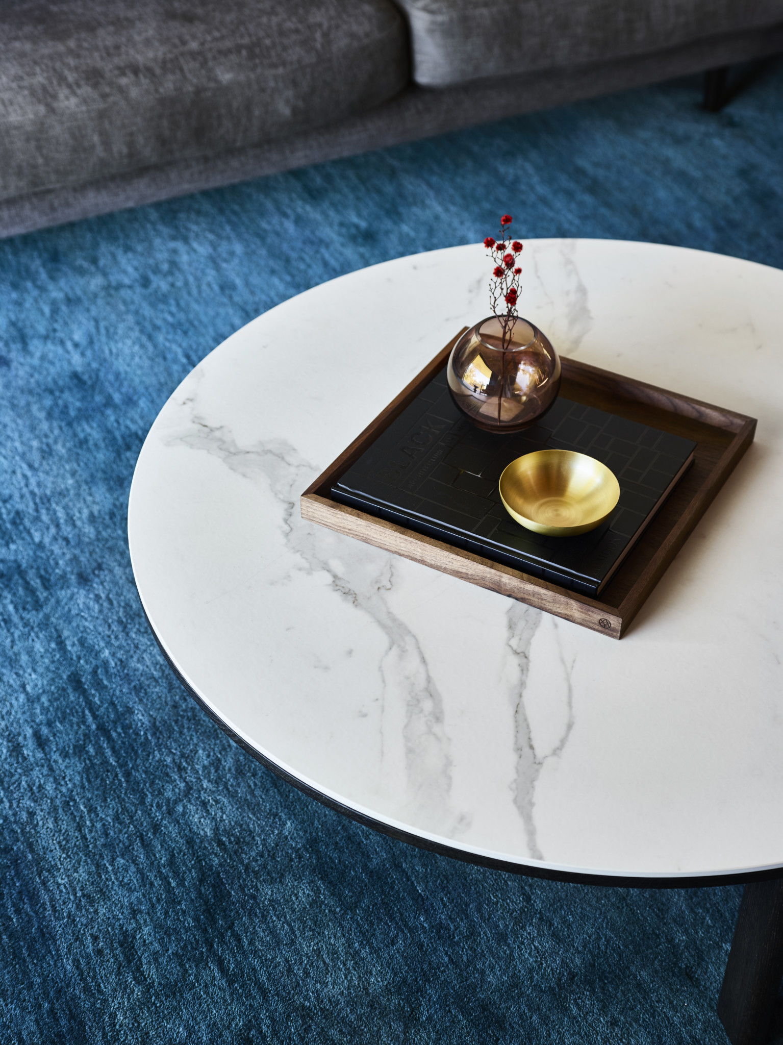 round table with bowl of little plant