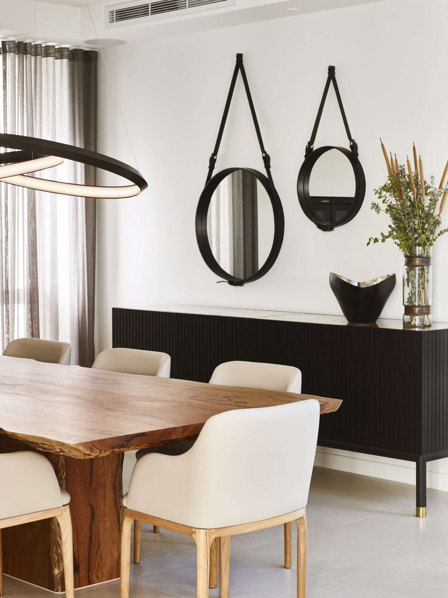 round mirrors on dining area