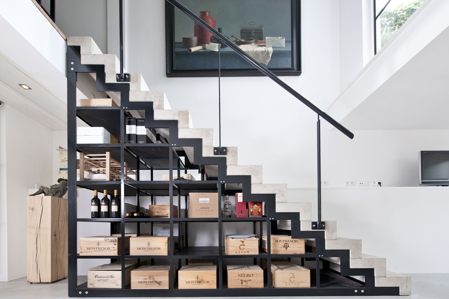 Design by Kodde Architects wine storage under stairs