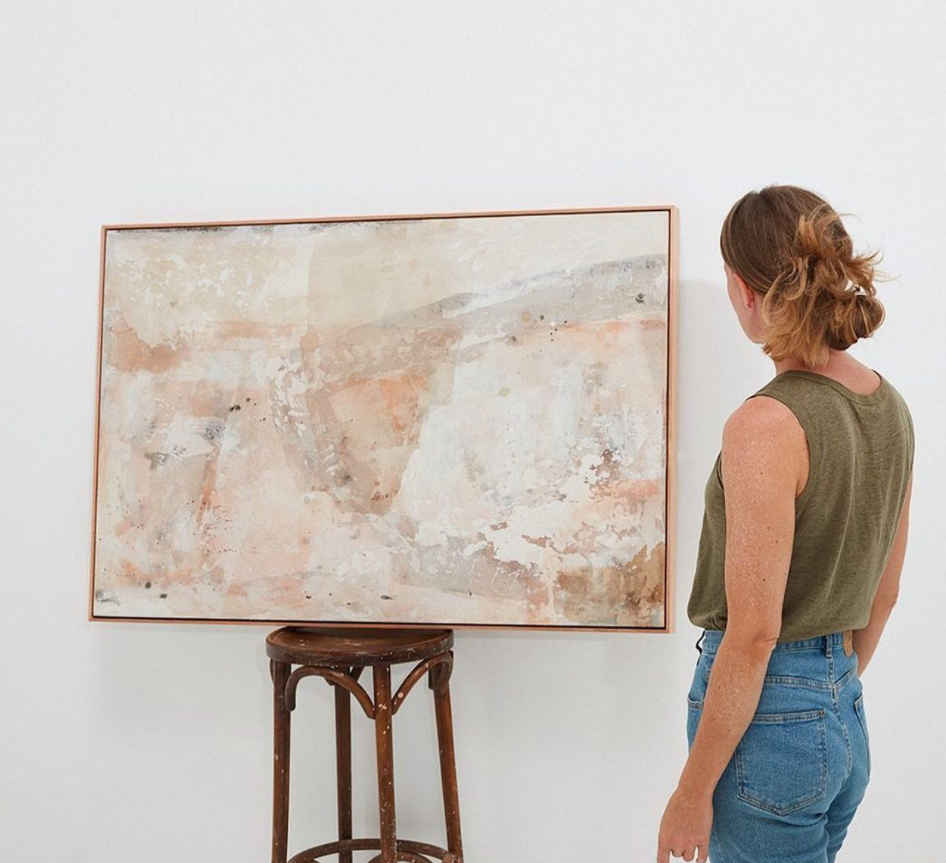 woman watching a painting at GALLERY RAYE