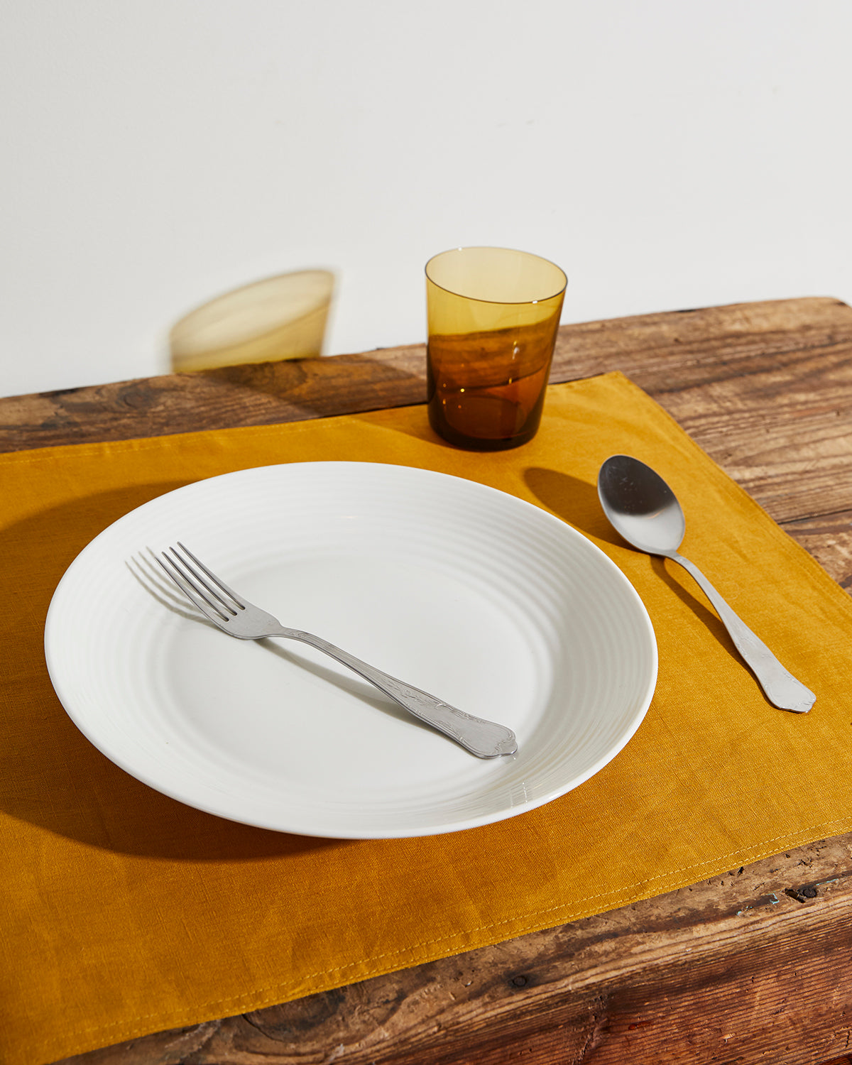 white plate silver spoon and fork